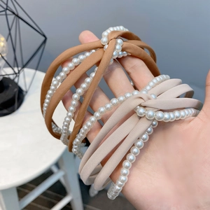 Elegant knot headbands with white pearls in brown and beige chiffon fabric
