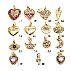 Selection of 18K gold-plated heart and eye charms with cubic zirconia for jewelry making