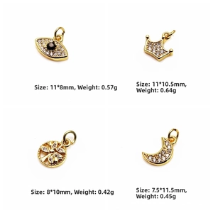Detailed views of gold-plated charms with cubic zirconia: Eye, Crown, Tree of Life, Crescent