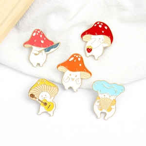 Set of five creative cartoon mushroom enamel pins featuring guitar and accordion musical themes