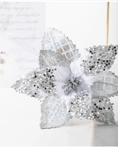 Macro shot of 17cm silver artificial Christmas flower with sparkling sequins and glitter