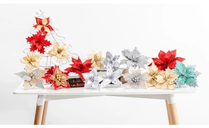 Close-up of artificial poinsettia flowers with glitter edges and fabric textures