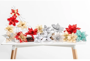 Close-up of sparkling 25cm artificial poinsettia flowers with glitter petals on table