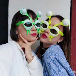 Funny green and lime alien googly eye sunglasses for novelty party photo props