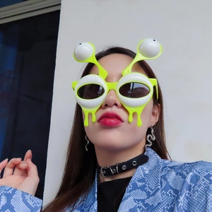 Funny neon green alien eyeball glasses for birthday party and photo props with liquid drip design