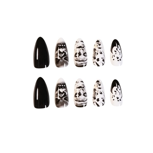 Dark punk skull press-on nails with black and white graffiti art in pointed almond shape