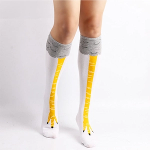 Funny chicken feet over-knee socks in white cotton knit with 3D yellow claw pattern