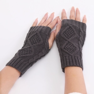 Close-up of dark grey knit fingerless gloves with diamond pattern and ribbed cuffs