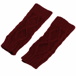 Macro detail of wine red knitted fingerless gloves with a classic diamond cable pattern