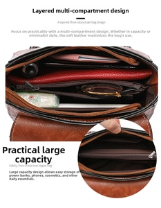 Detail of a brown pebbled leather crossbody bag showing its multi-compartment interior