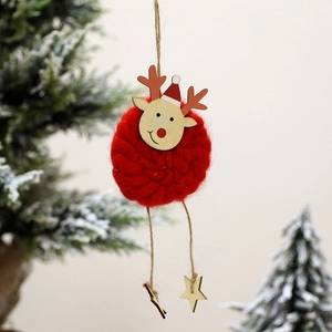 Charming red felt Christmas reindeer ornament with wooden star hanging on a festive tree
