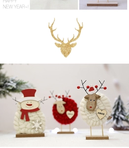 Close-up of handmade felt Christmas figurines including snowman and deer on wooden bases