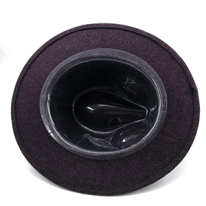 Top view of deep purple wool felt hat showing thick texture and inner support shape