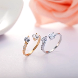 Luxurious gold and silver heart zircon open rings with side accents on white surface