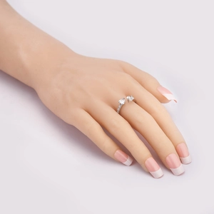 Macro detail of silver open ring featuring large zircon stones and shimmering accents