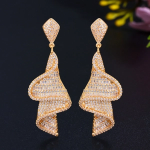 Geometric spiral silver needle earrings with shimmering pavé zircon crystals in gold finish