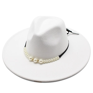 Close-up of white wool fedora hat with black ribbon and elegant pearl decorations