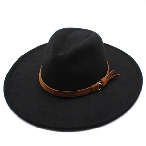 Detail of wide brim black wool fedora with brown leather band and gold buckle