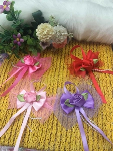 Set of four handmade satin rose corsages with faux pearls and lace backing decoration