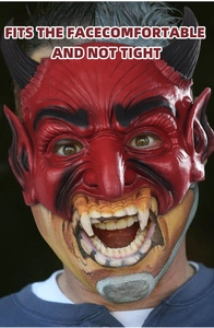 Detailed close-up of a red latex devil mask with horns and fangs for Halloween cosplay