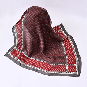 Macro detail of geometric grid patterns on red and grey silk scarf texture
