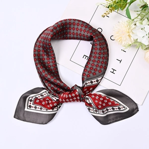 Detail view of 70cm square scarf with grey and red geometric patterns in a stylish knot