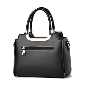 Classic black leather handbag with white contrast stitching and gold metal accents