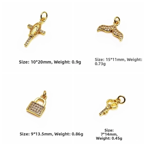 Macro view of gold-plated cross and key pendants with zircon inlays and dimensions