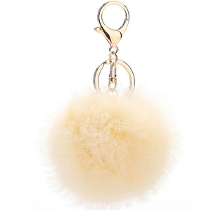 Detail of soft beige faux rabbit fur pom pom with polished gold keychain clip and ring