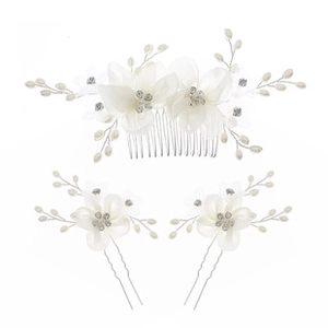 Close-up of bridal hair accessory set with silk petals, rhinestones and pearls