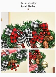 Detail view of rustic Christmas wreath featuring red truck decor and pine cones