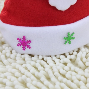 Red plush Christmas hat with white fur trim and shiny colorful snowflake sequins decoration