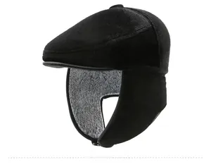 Side view of black winter newsboy hat with thick faux fur ear flaps and warm lining