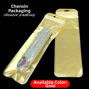 Detail view of golden zip lock packaging pouch with grid texture and hanging hole