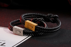 Close-up of double-layer woven leather bracelets with gold and silver magnetic steel clasps