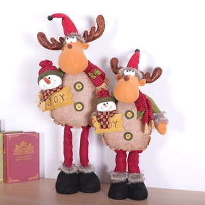 Standing reindeer plush Christmas decoration with red hat and beige burlap body in two sizes