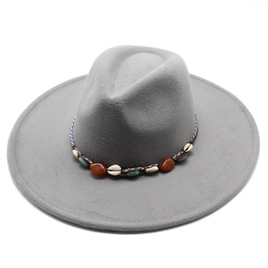 Detailed close-up of dark grey wool fedora with bohemian shell and stone band decoration