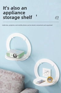 White semi-circular wall shelf for projector and small devices on light blue wall
