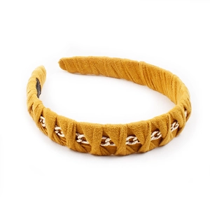 Mustard yellow suede headband with gold chain trim in a vintage woven design for women