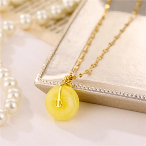 Elegant gold titanium necklace with amber dolphin safety buckle pendant and pearls