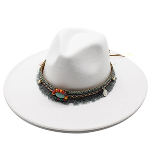 Detail of white wool fedora hat featuring ethnic beaded band and turquoise stone fringe