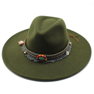 Close-up of bohemian hat band with turquoise stone, coins, and ethnic woven beads