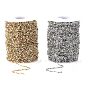 Detail of gold and silver beaded titanium steel chains with colorful enamel drops