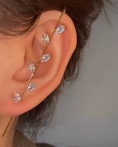 Detailed view of leaf-shaped gold ear climber with sparkling marquise-cut zircons