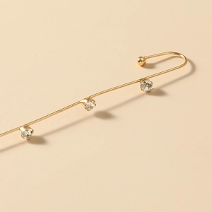 Detailed view of minimalist gold ear climber with three sparkling crystal rhinestones