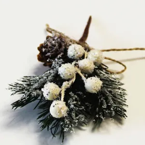 Artificial Christmas bouquet with pine cones, snowy berries and pine needles for decor
