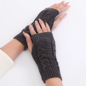 Unisex dark grey cable knit fingerless gloves showing texture and stylish wrist warmer design