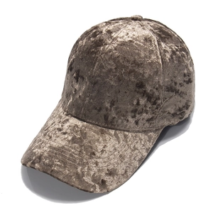 Detailed macro view of the bronze velvet baseball cap fabric texture and stitching