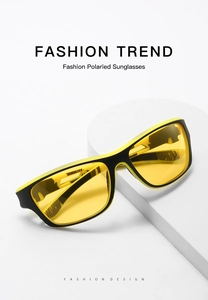 Close-up of polarized sports sunglasses with yellow lenses on a minimalist white stand