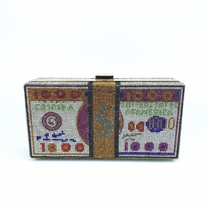 Detailed view of luxury $1000 bill rhinestone evening clutch with colorful crystals